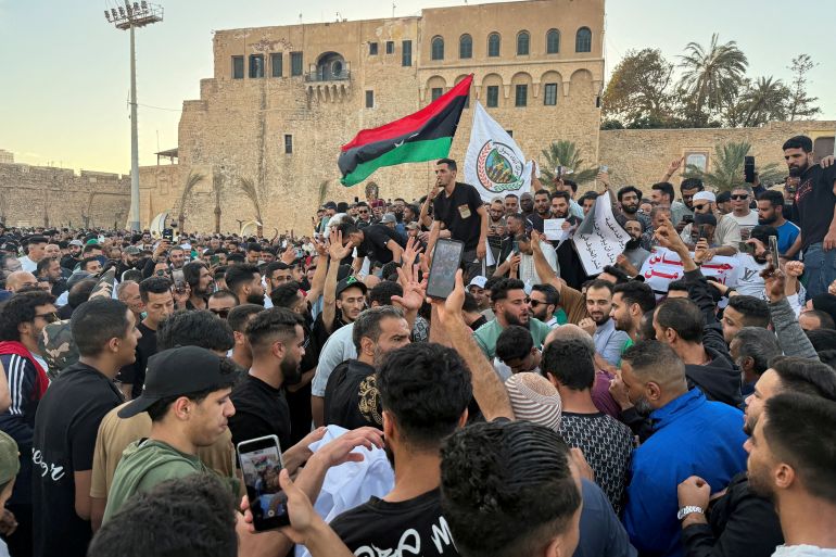 FILE PHOTO: Demonstrators demand the overthrow of the Libya's Government of National Unity headed by Abdulhamid al-Dbeibah, in Martyrs' Square in Tripoli, Libya. May 16, 2025. REUTERS/Ayman al-Sahili/File Photo