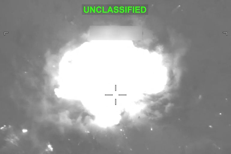 Fire and smoke rise from explosions, as seen in a video screengrab.