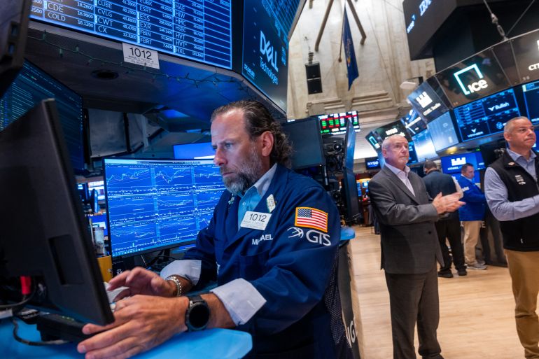 NEW YORK, NEW YORK - JULY 07: People work on the floor of the New York Stock Exchange (NYSE) on July 07, 2026 in New York City. The Dow was up slightly in morning trading after it closed Monday above 53,000 for the first time. Spencer Platt/Getty Images/AFP (Photo by SPENCER PLATT / GETTY IMAGES NORTH AMERICA / Getty Images via AFP)