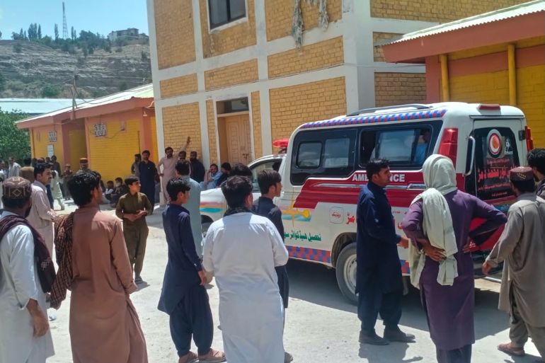 People watches an ambulance arrive with the bodies of police officers who were killed in an militants overnight attack, at a hospital in Ziarat, a district in Pakistan's southwetern Balochistan province, Tuesday, July 7, 2026. (AP Photo)