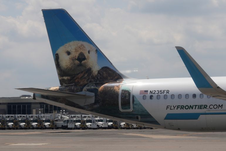 The tail of a Frontier Airlines plane is seen on the tarmac at Ronald Reagan Washington National Airport in Arlington, Va., Monday, June 29, 2026. (AP Photo/Carolyn Kaster)