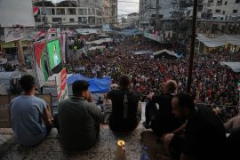 Palestinians watch a live broadcast of the World Cup round of 16 soccer match between Argentina and Egypt in Nuseirat, central Gaza Strip, Tuesday, July 7, 2026. (AP Photo/Abdel Kareem Hana)