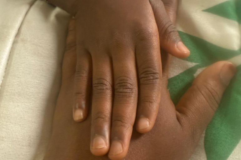Binta, 30, with her seven-year-old daughter, whom she is determined to protect from FGM