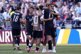epa13093499 Players of USA comfort each other after losing the FIFA World Cup 2026 Round of 16 match USA against Belgium, in Seattle, Washington, USA, 06 July 2026. EPA/STEPHEN BRASHEAR