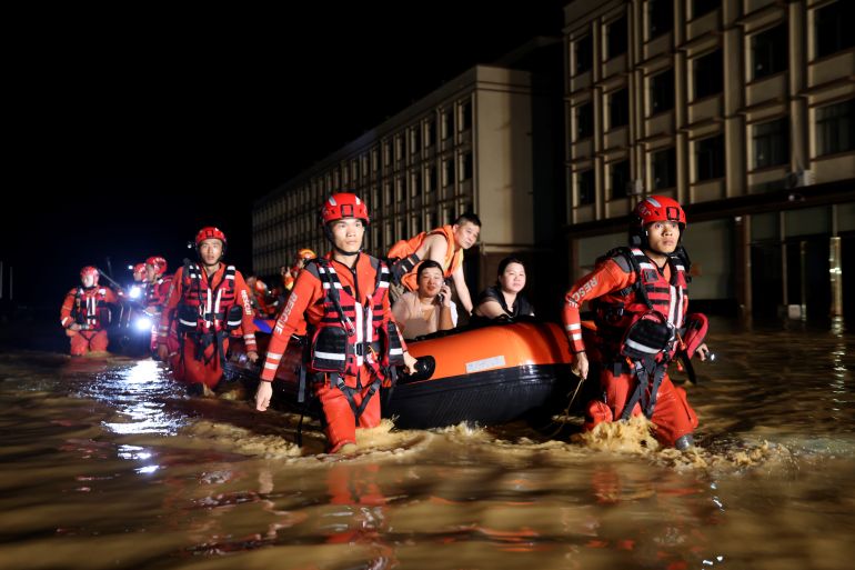 Rescue workers evacuate residents