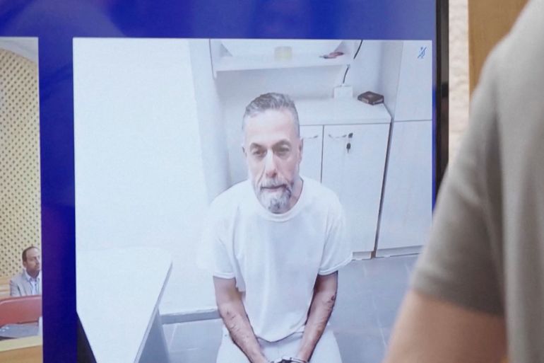 Palestinian doctor Hussam Abu Safiya, who was arrested by the Israeli military in Gaza in late 2024 and still held in prison, appears via video link at the Israeli Supreme Court hearing in Jerusalem