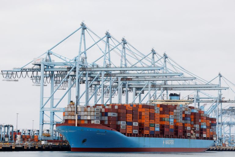 FILE PHOTO: Shipping containers sit on a Maersk vessel docked at the port of Los Angeles in Long Beach, California, U.S., March 10, 2026. REUTERS/Caroline Brehman/File Photo