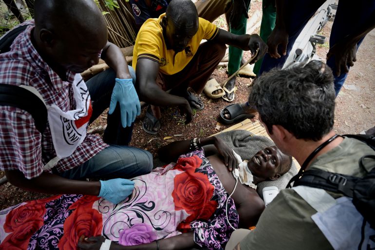 ICRC Nurses attend to a victim of gunshot wounds at Ganyiel Primary Health Center before being evacuated to Juba for further medical care. [Handout/ICRC]